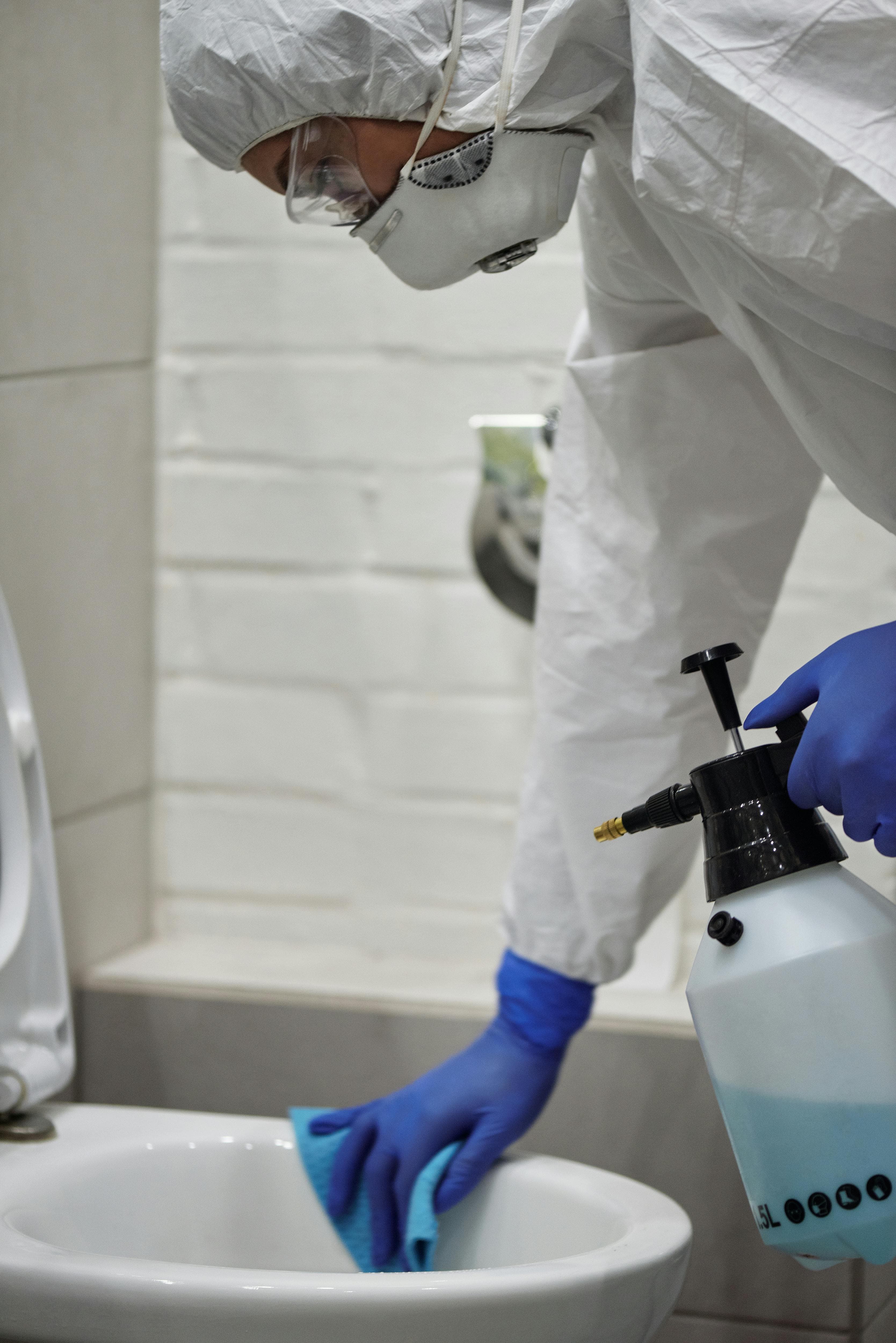 A Cleaning Ninja team member preparing equipment for a job